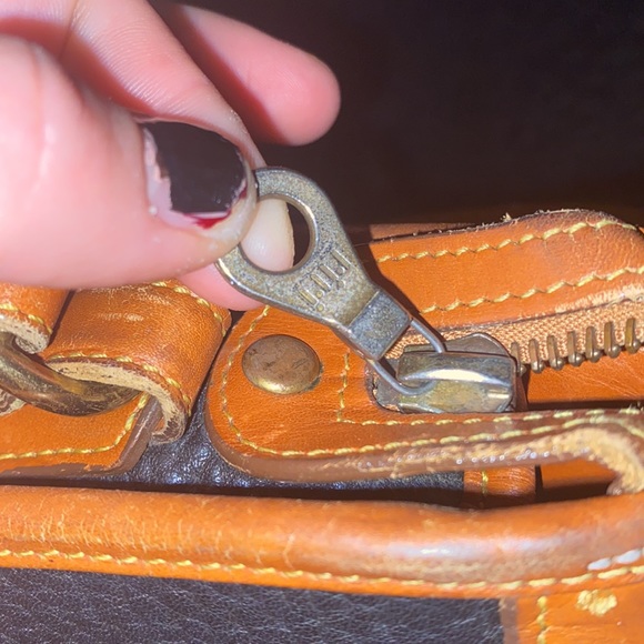 Dooney & Bourke Vintage and VERY rare. All weather leather. Its a beauty.